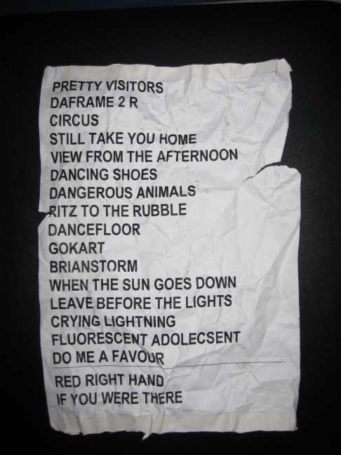 Torn and creased Arctic Monkeys setlist from the Powerstation in Auckland, with Crying Lightning and Fluorescent Adolescent